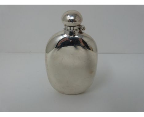 A Silver Harrods hip flask, Sheffield 1991, swilvel lock top. (171g). 