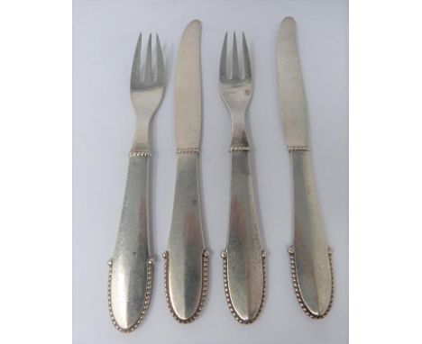 A Georg Jensen silver knife and fork set, full Danish hallmarked and makers mark for Georg Jensen. (187g). 