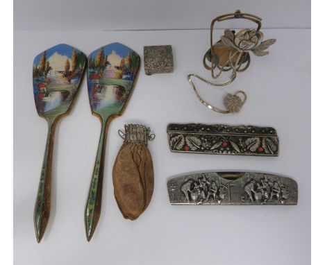 A collection of collactibles including, two enamel mirrors, two white metal combs, a leather coin pouch, Art Nouveau waterlil