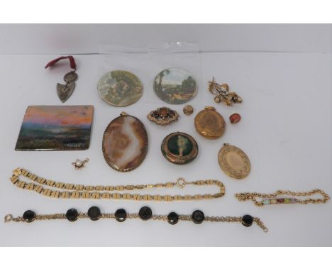 A collection of gold plated and yellow metal jewellery including enamel plaques, coral snake button and 9 ct gold and culture