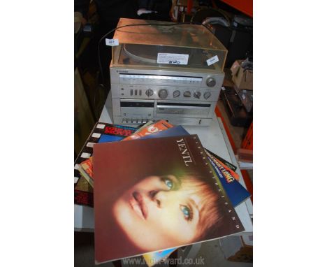 A record player, radio tape deck and miscellaneous records, (running at time of lotting).