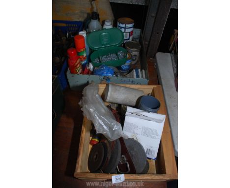 A metal tray of cleaning products, vehicle repair kits, car paint, wing nuts, bench grinder wheels.