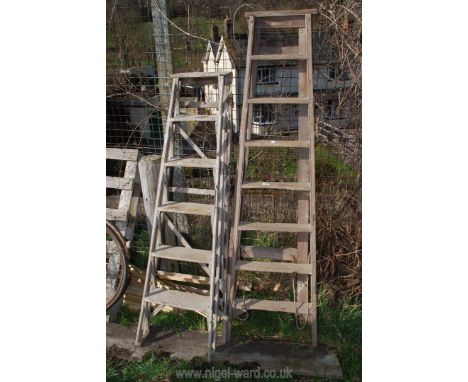 Two wooden step ladders: six and eight rungs.