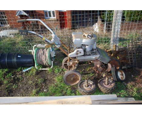 A Rotavator with Briggs &amp; Stratton engine (good compression), with extra feet and wheels.