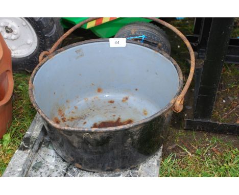 A black enamel jam pan.