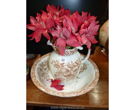 Ceramic wash bowl and jug with artificial flowers.