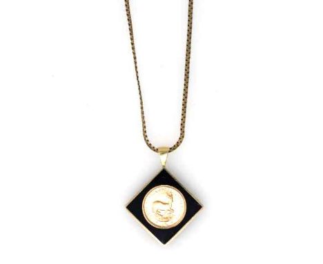 A 1975 GOLD COIN PENDANT 22ct, gold sealed in a Perspex frame surrounded by black enamel, 9ct gold snake-style chain with a r