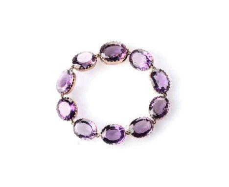 AN AMETHYST BRACELET Set with 10 oval faceted amethysts with a combined weight of apprximatky 41 carats, each set in an intri