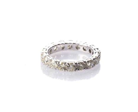 A FULL DIAMOND ETERNITY RING claw-set with eighteen round brilliant-cut diamonds weighing approximately 4,5 carats, colour ap