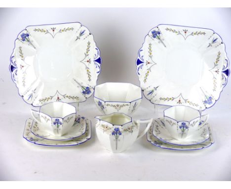 A Shelley twelve setting tea service in the Queen Anne Shape
Decorated in the blue iris pattern, comprising milk jug, sugar b