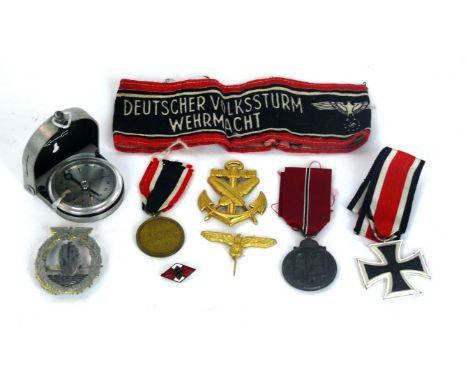 A collection of WWII Nazi memorabilia 
To include Iron Cross Second class, Mine Clearance badge, War Merit medal dated 1939, 