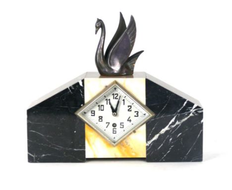 An Art Deco marble and slate mantle clock
Having a spelter swan finial, the face marked Bjours, height 31cm
