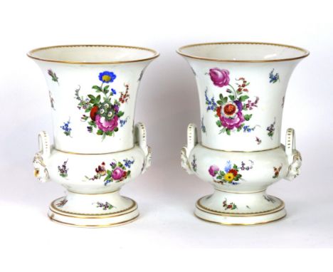 A pair of 19th century hand painted porcelain twin handled vases
Each having floral sprays, surrounding mask head handles, gi