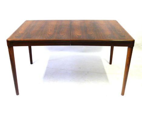 A Danish post-war Bramin Mobler rosewood extending dining table 
Designed by H.W. Klein, circa 1963, complete with one extra 