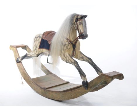 A large and imposing Victorian Parker rocking horse with original opal dapples and substantial ash bow
The horse is classed a