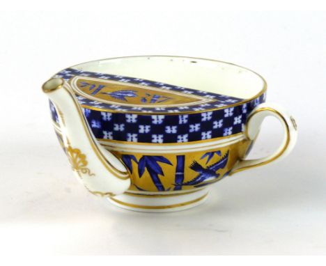 A 19th Century Coalport invalid feeder
Having Aesthetic movement decoration of birds and landscape, printed factory marks to 