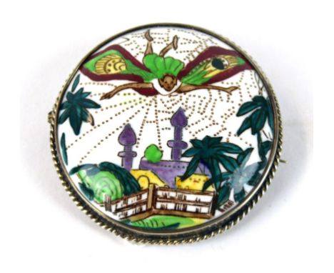 A Wedgwood Fairyland ceramic brooch  
Decorated with a large fairy flying above temple scenes, designed by Daisy Makeig-Jones
