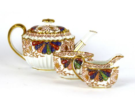 A Copeland three piece tea service
Decorated in the Imari palette, comprising tea pot, sugar bowl, milk jug, each with printe