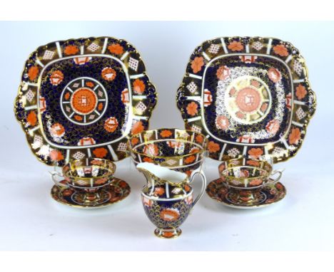 A Royal Crown Derby Imari decorated twelve setting tea service
Comprising milk jug, sugar bowl, two bread plates, twelve cups