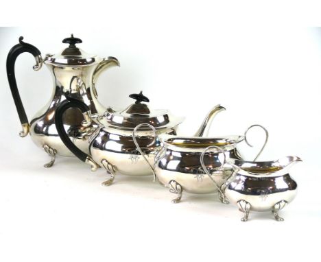 A four-piece silver tea service, by Joseph Gloster Ltd., Birmingham 1922
Of plain, oval, baluster form, with scroll handles, 