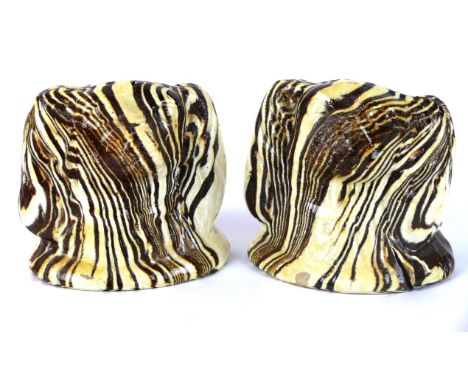 A pair of 19th Century agate ware sash window stops
Each modelled in the form of spaniel's heads, height 10cm.
