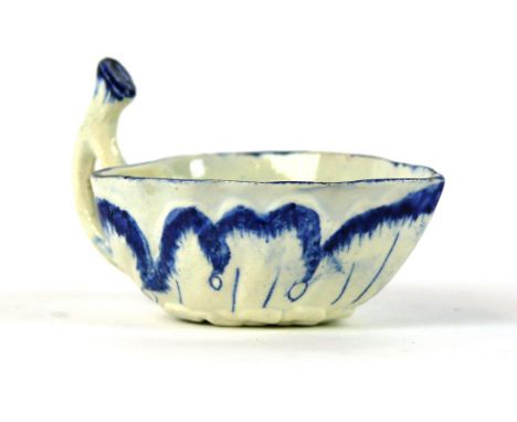 An 18th century Wedgwood porcelain pickle dish
Having relief blue and white decoration with leaves, impressed factory marks a
