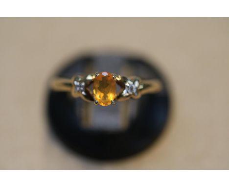 Ladies Oval Fire Opal claw set ring with cross over shoulders.  Size N. 2g total weight 