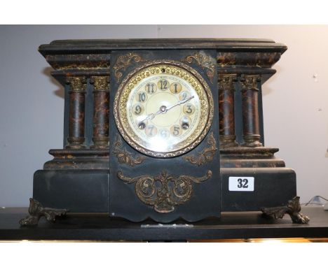 Later Victorian Faux slate mantel clock supported on brass paw feet 