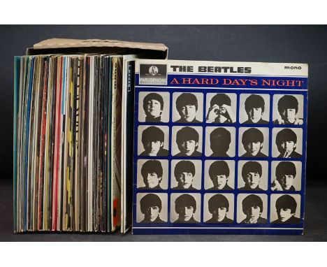 Vinyl - Over 40 LP's and 12" singles mainly rock and pop to include The Beatles, The Rolling Stones, Fleetwood Mac, Marillion