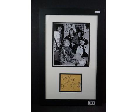Memorabilia - The Rolling Stones autographed page mounted with a picture of the band.  Framed and glazed. 