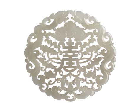 Jade pendantChinese, 19th Centurycarved with a central long life symbol, within a surround of bats, dragons and ruyi, 7.25cm 
