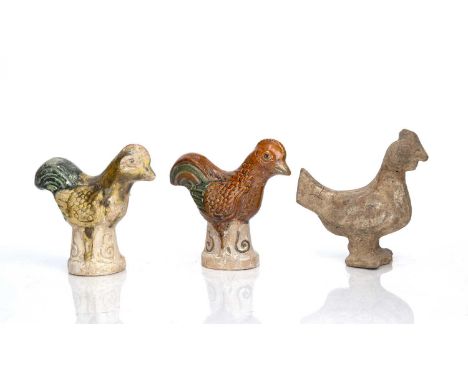 Three pottery models of cockerelsChinese, Two Tang Dynasty and the other later (orange cockerel)comprising of an unglazed mod