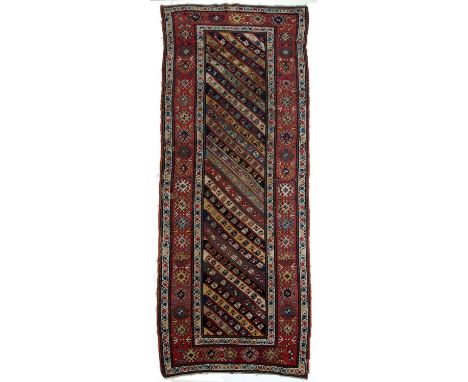 Polychrome large rug/runnerCaucasianwith central panel having diagonal linear foliate designs within a multiple border, 257cm
