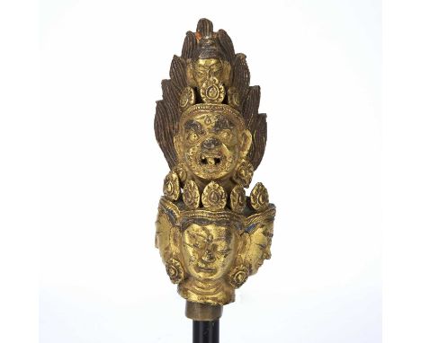 Headpiece of a sceptre or large vajraTibetan, 15th/16th Centurygilt repoussé bronze, and ornate cast iron with traces of blue