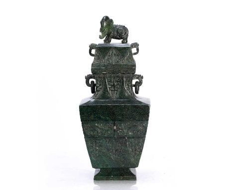 Green hardstone archaic style vase and coverChinesewith elephant finial, carved ring handles and taotie decoration, with trac