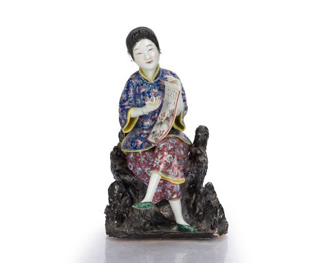 Portrait figure of an artistChinese, late 19th Centurythe seated figure holding a brush in one hand and a scroll in the other