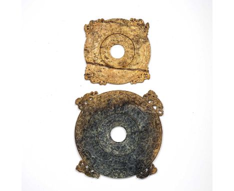 Two jade carved Bi discsChinesethe first of mottled cream and brown colour, carved on both sides, the outer side carved with 