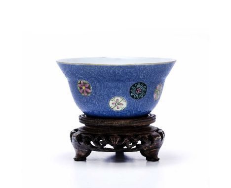 Porcelain famille rose bowlChinese, 19th Centurydecorated with floral medallions set against a blue ground, the base with a b