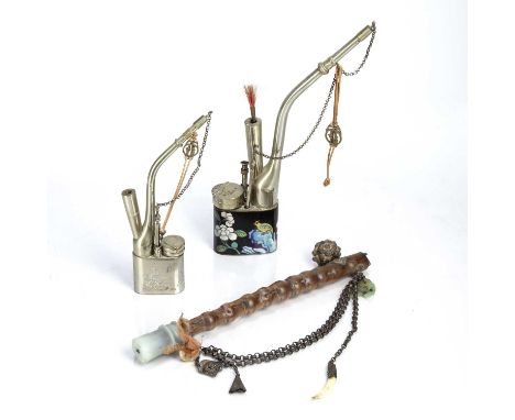 Bamboo opium pipeChinese, 20th Centurywith a translucent stone or jade finial, with a metal chain hanging with various orname