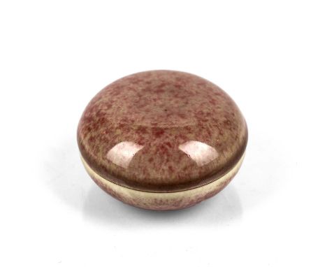 Peach bloom circular domed Vermilion ink boxChinese, Kangxi (1662-1722)the glaze varying with a red border around the rim of 