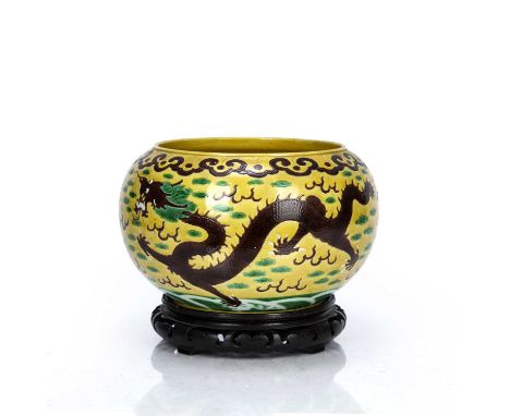 Yellow ground bowlChinese, 19th Centurydecorated with dragons and flaming pearls, within a ruyi border, with Kangxi incised s