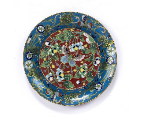 Cloisonne shallow dishChinese, Qianlong periodthe central red ground panel with inlaid flowers and a butterfly, within a pale