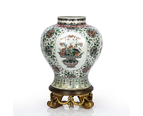 Famille verte porcelain baluster vase with an ormolu standChinese, 19th Centurypainted with panels of baskets of flowers, wit