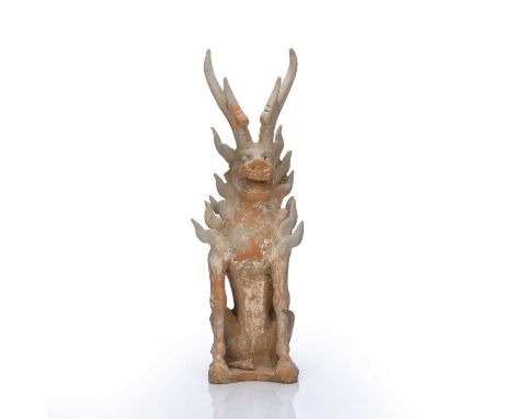 Pottery model of an earth spiritChinese, Tang dynastyunglazed painted with a red pigment, with spiked wings, hooves and two h