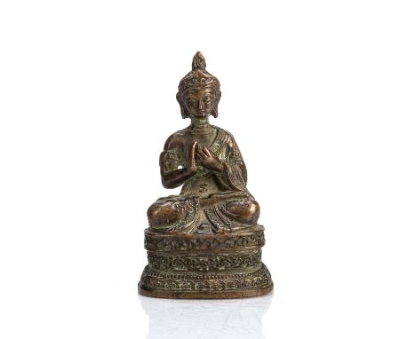 Bronze figure of the BuddhaSino-Tibetan, 18th Centurywith his hands in the teaching mudra, some remnants of gilding, on an el