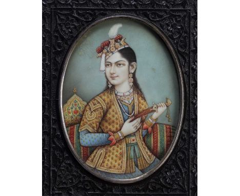 Oval miniature Mughal portrait of a courtesanIndia, probably Delhi circa 1830/40on ivory, the half length figure holding a ja