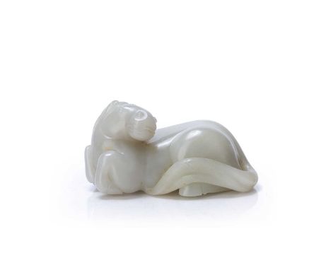 White jade carving of a reclining horseChinese 18th/19th Centurythe horse looking over its left shoulder and with the long ta