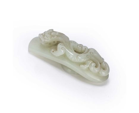 White jade belt buckleChinese, late 18th Centurycarved as a Chilong dragon, 8.4cm acrossProvenance: From the collection of th