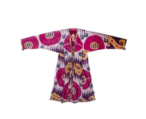 Ikat decorated Chapan Uzbekistandecorated in traditional tie-dye colours, the inner lining decorated in flowers 130cm high (a