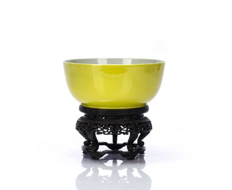 Imperial yellow bowlChinesethe exterior covered with a bright lemon-yellow glaze, the foot bearing the six-character mark Yon